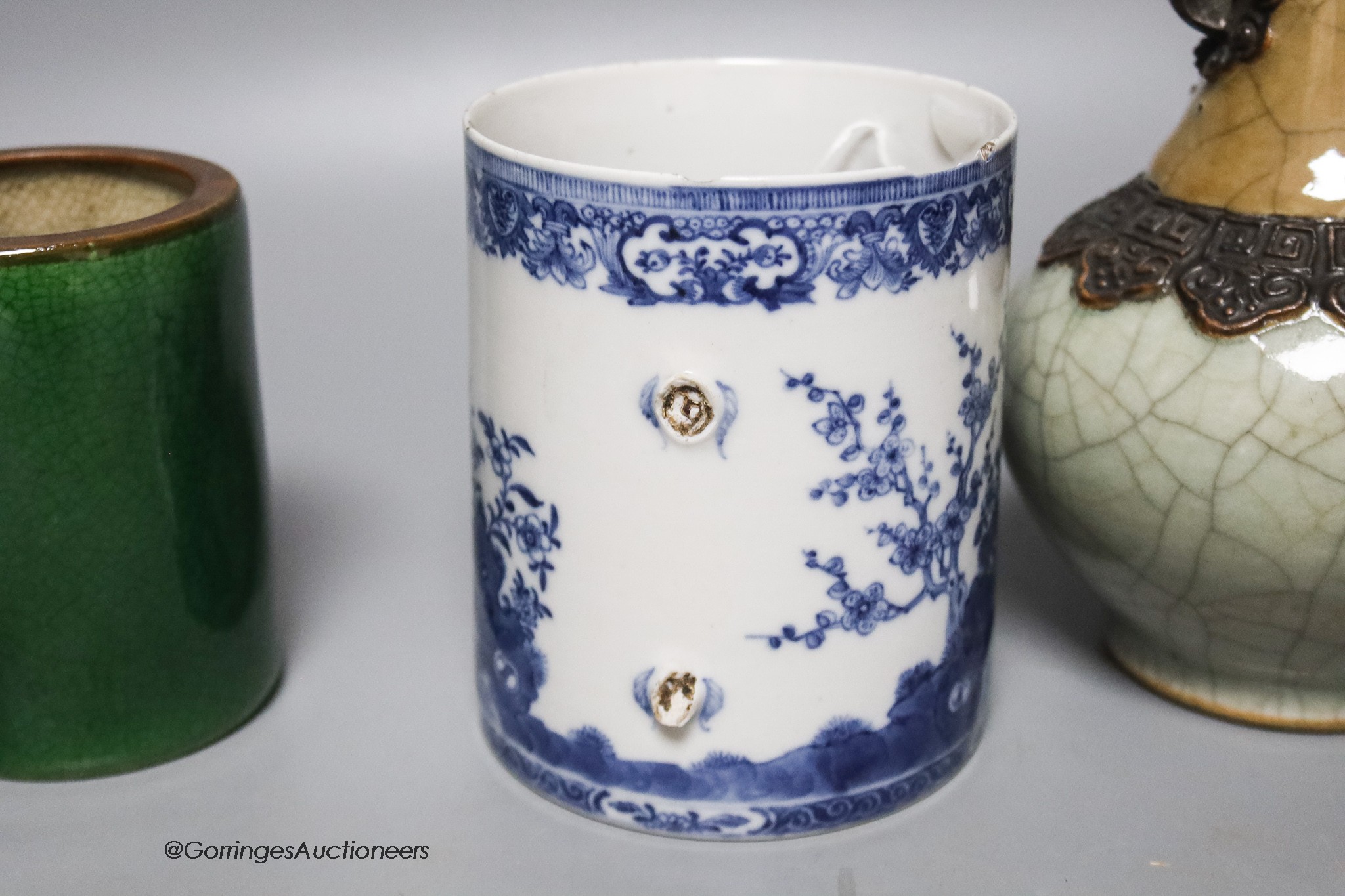 A Chinese crackleglaze vase, a blue and white brush pot and a green glazed brush pot, tallest 22cm